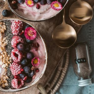 Delicious smoothie bowls topped with fresh berries, perfect for a healthy breakfast.